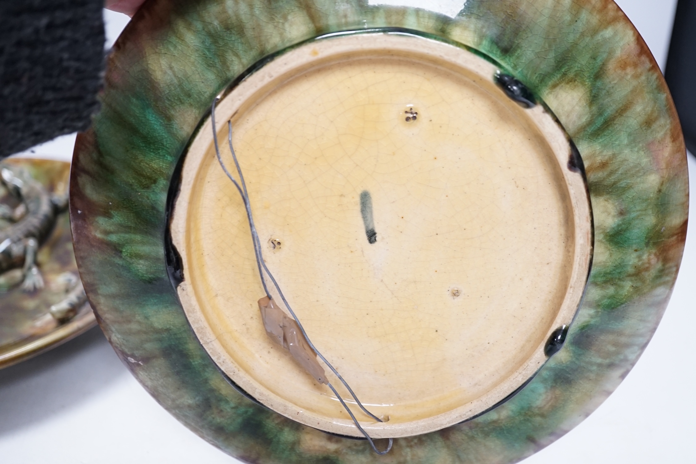 A pair of Palissy style Majolica glazed lizard plates, 23cm in diameter